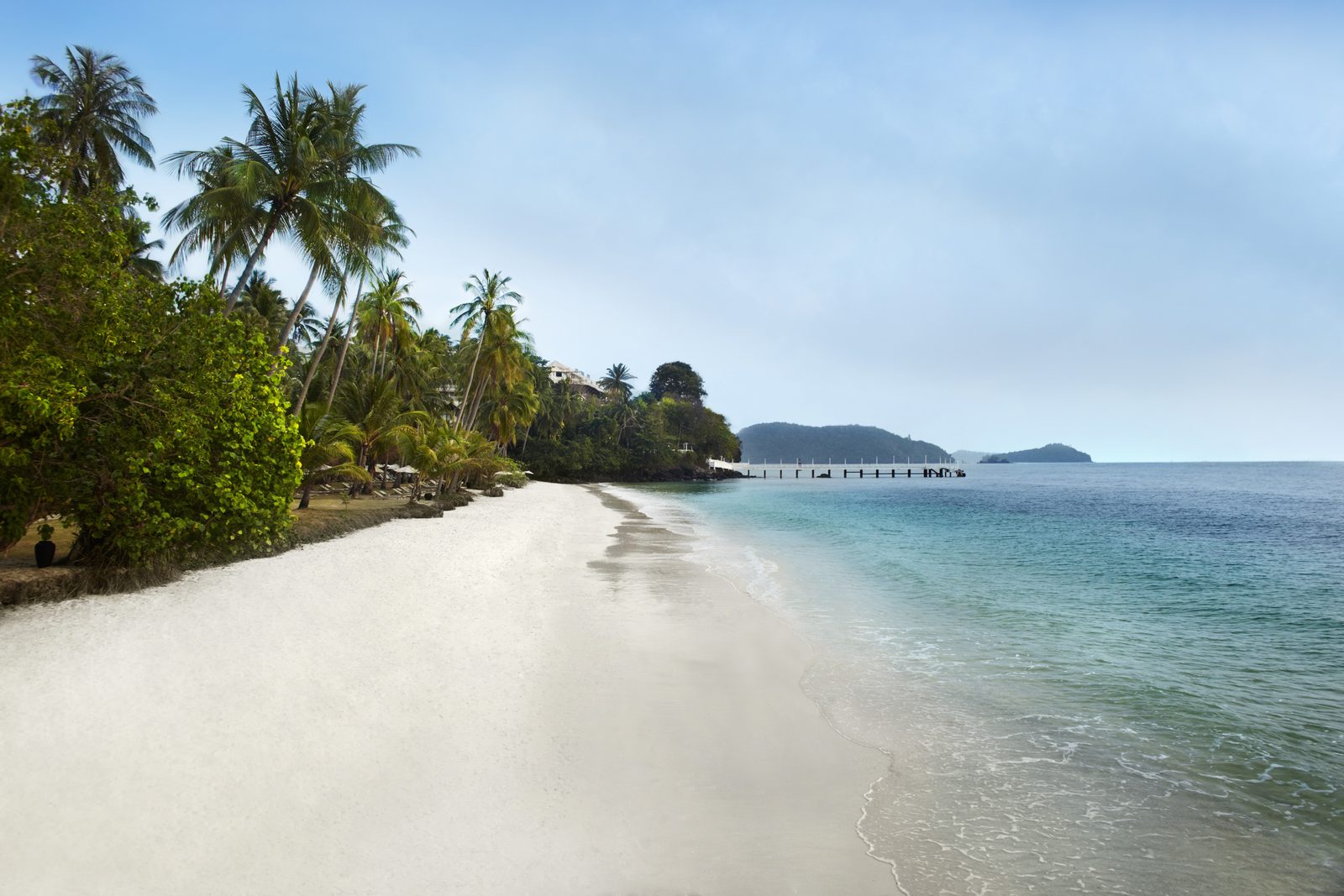 Palm-fringed private sandy beach at Cape Panwa Hotel, Phuket