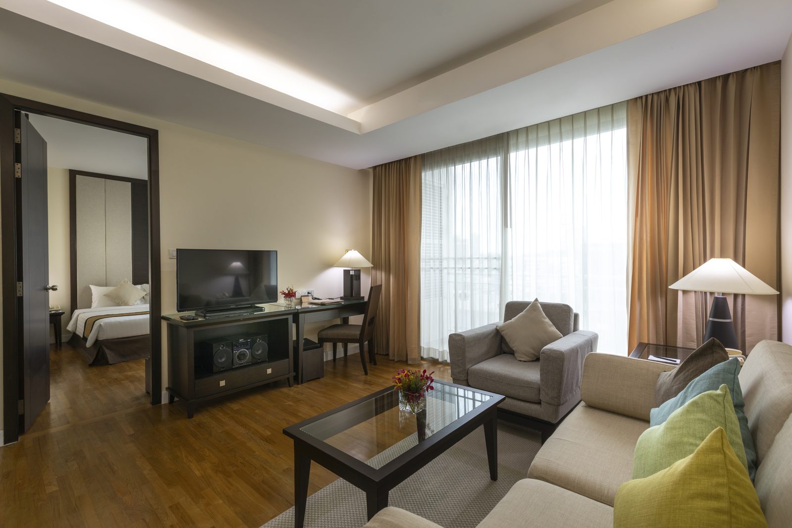 One Bedroom Suite living room with the bedroom beyond at Cape Racha Hotel, Sriracha