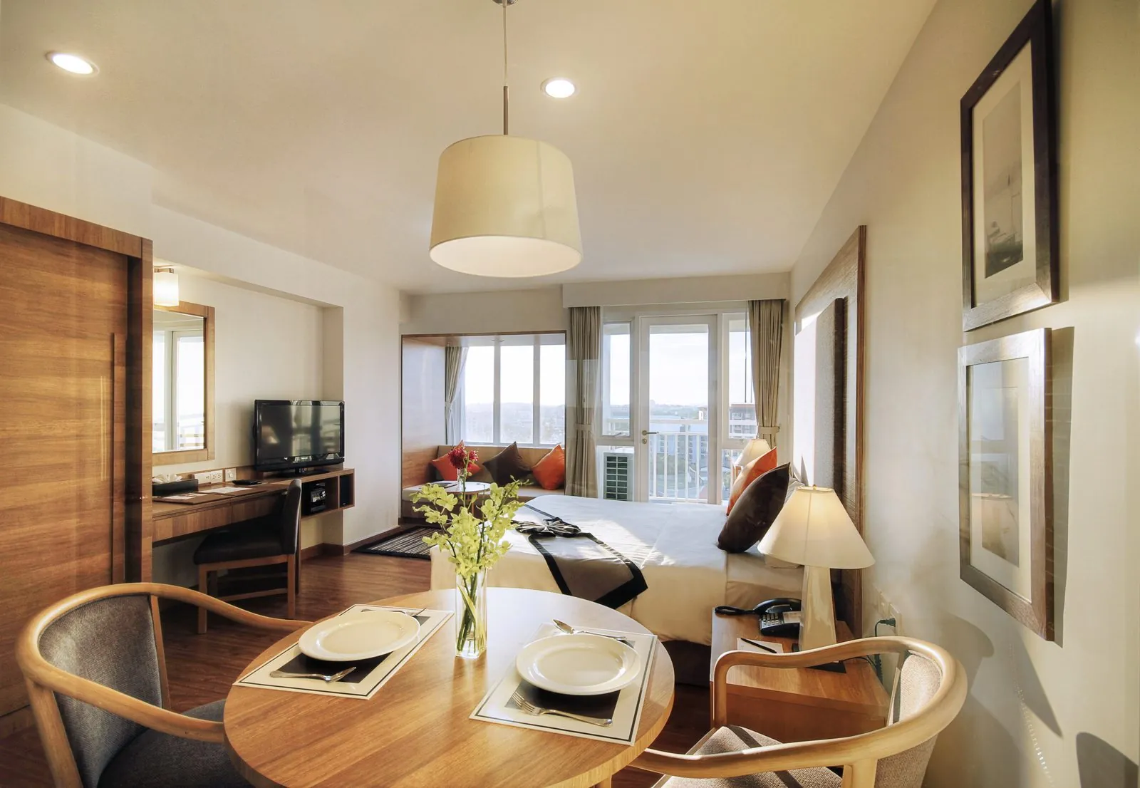 Deluxe Room with bed and dining table at Classic Kameo Hotel, Rayong