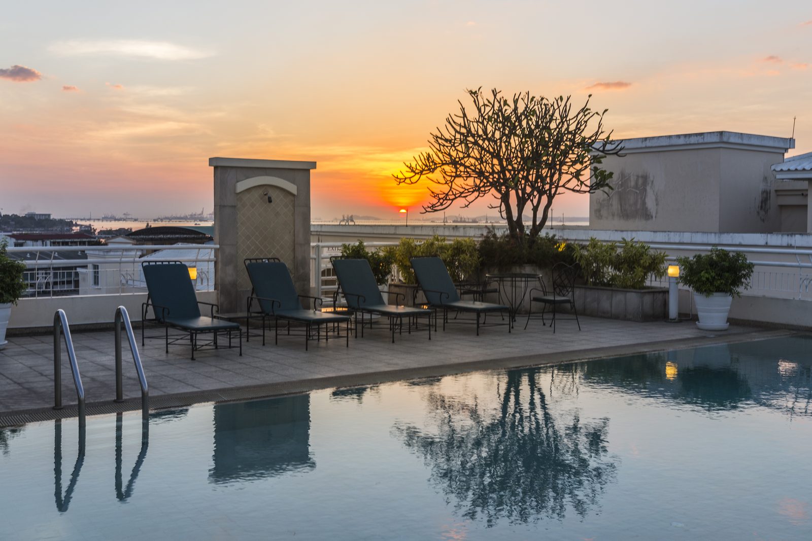 Skyline outdoor pool at sunset at Classic Kameo Hotel, Sriracha