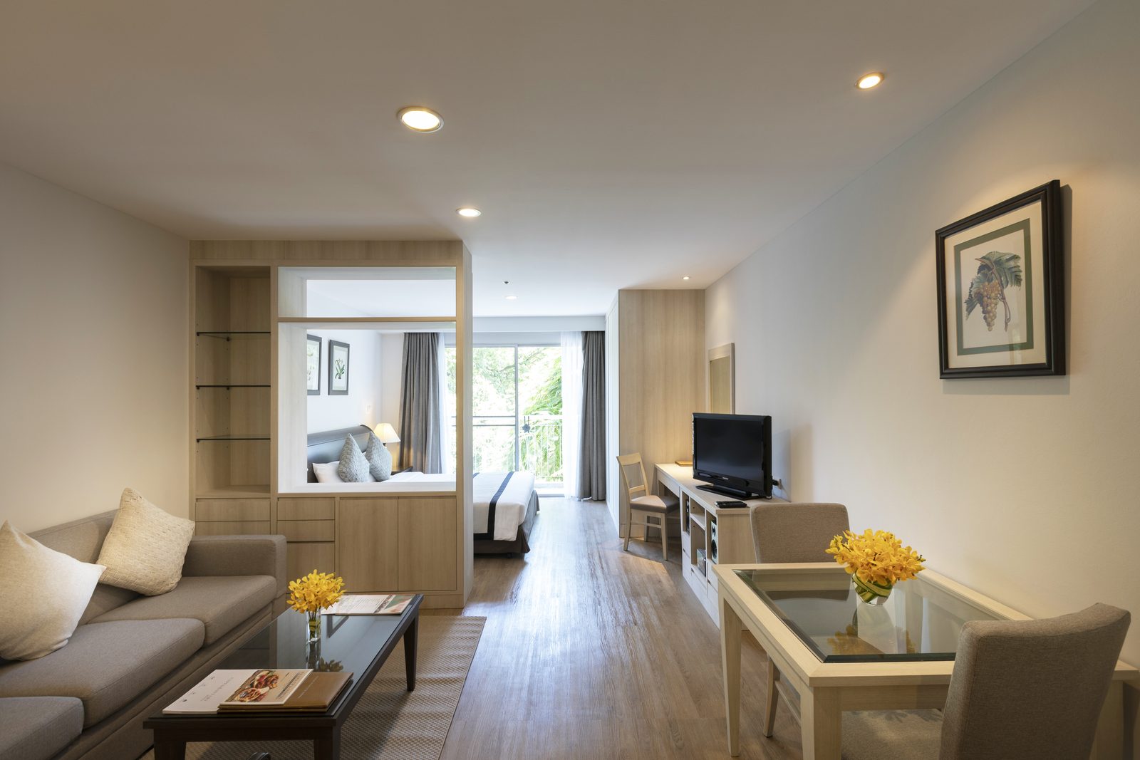 Studio Suite living area with the sleeping area beyond at Classic Kameo Hotel, Sriracha
