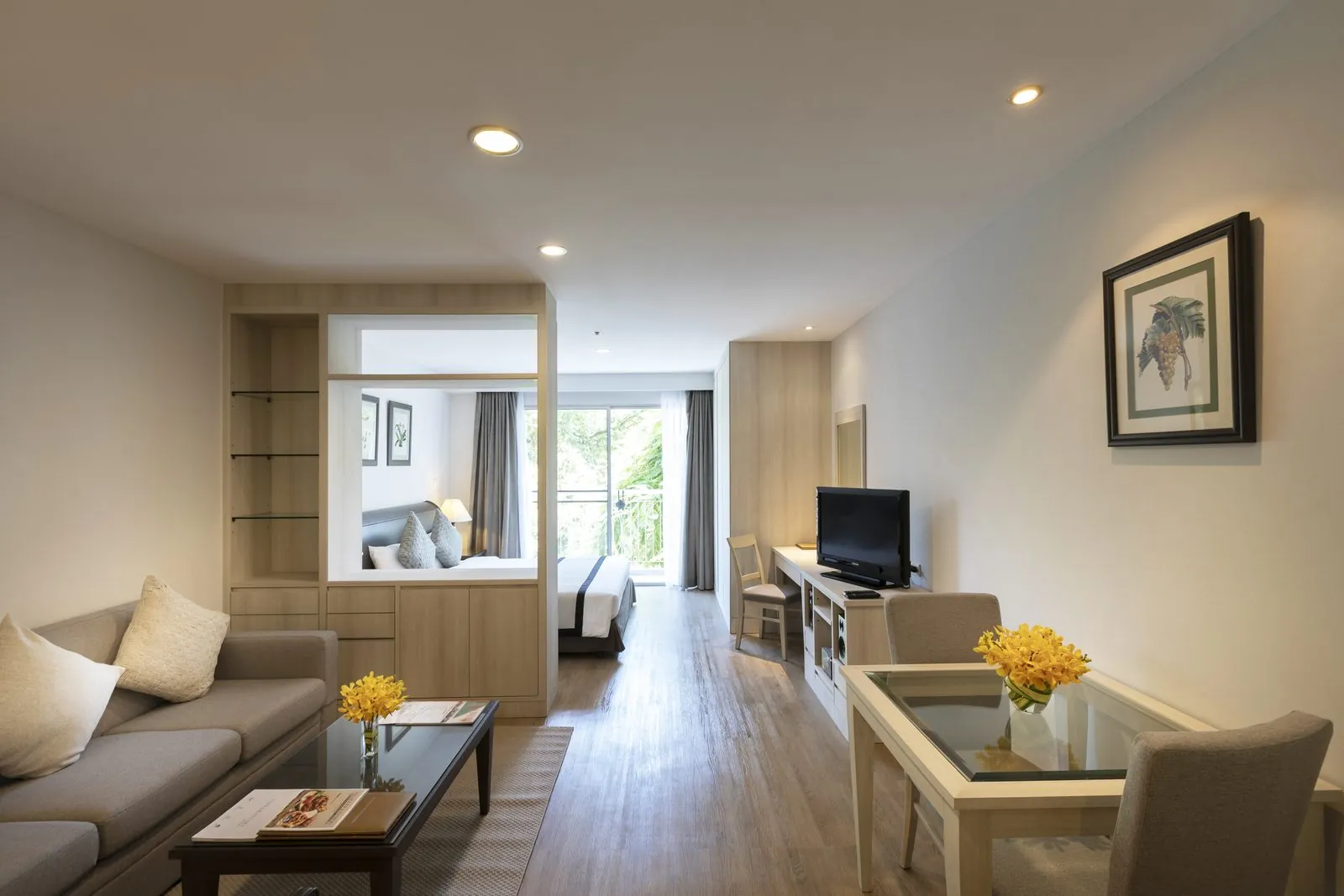 Studio Suite living area with the sleeping area beyond at Classic Kameo Hotel, Sriracha