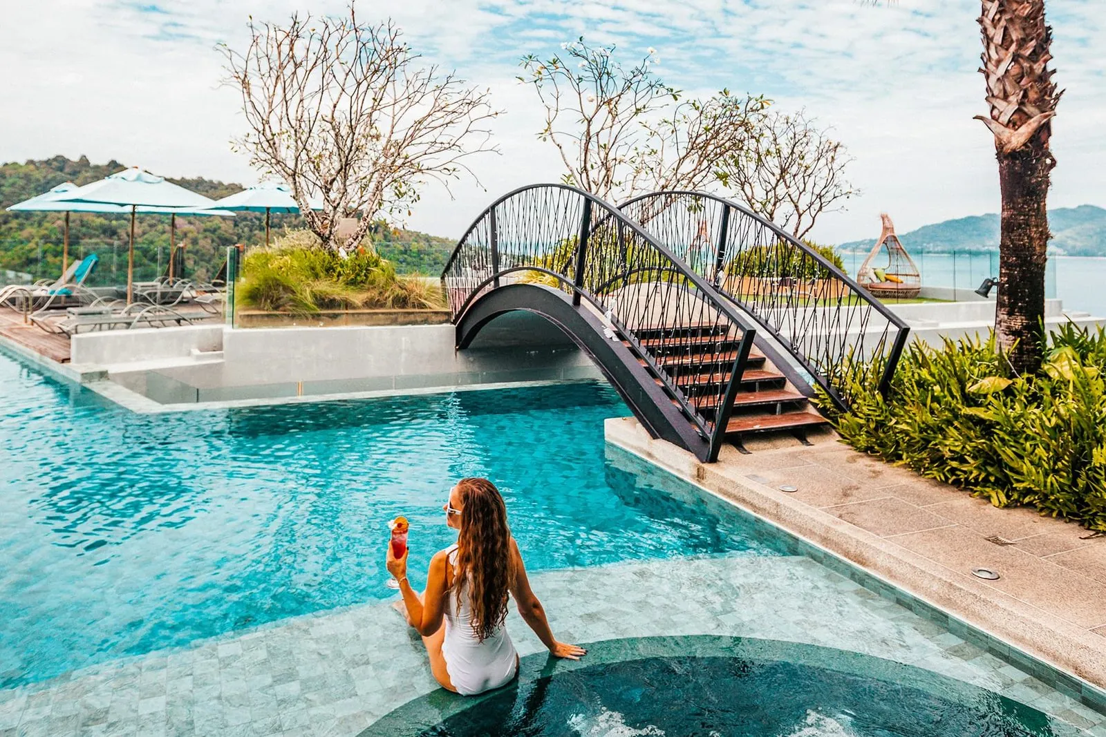Crest Resort infinity pool with footbridge and Andaman Sea view
