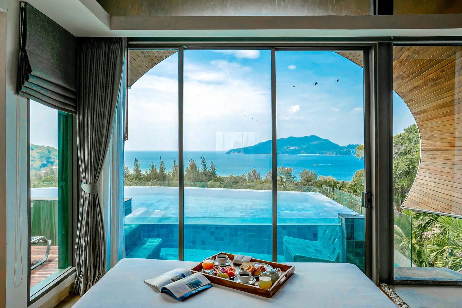 Premier Panorama Pool Villa bedroom at Crest Resort looking over its private pool to the sea