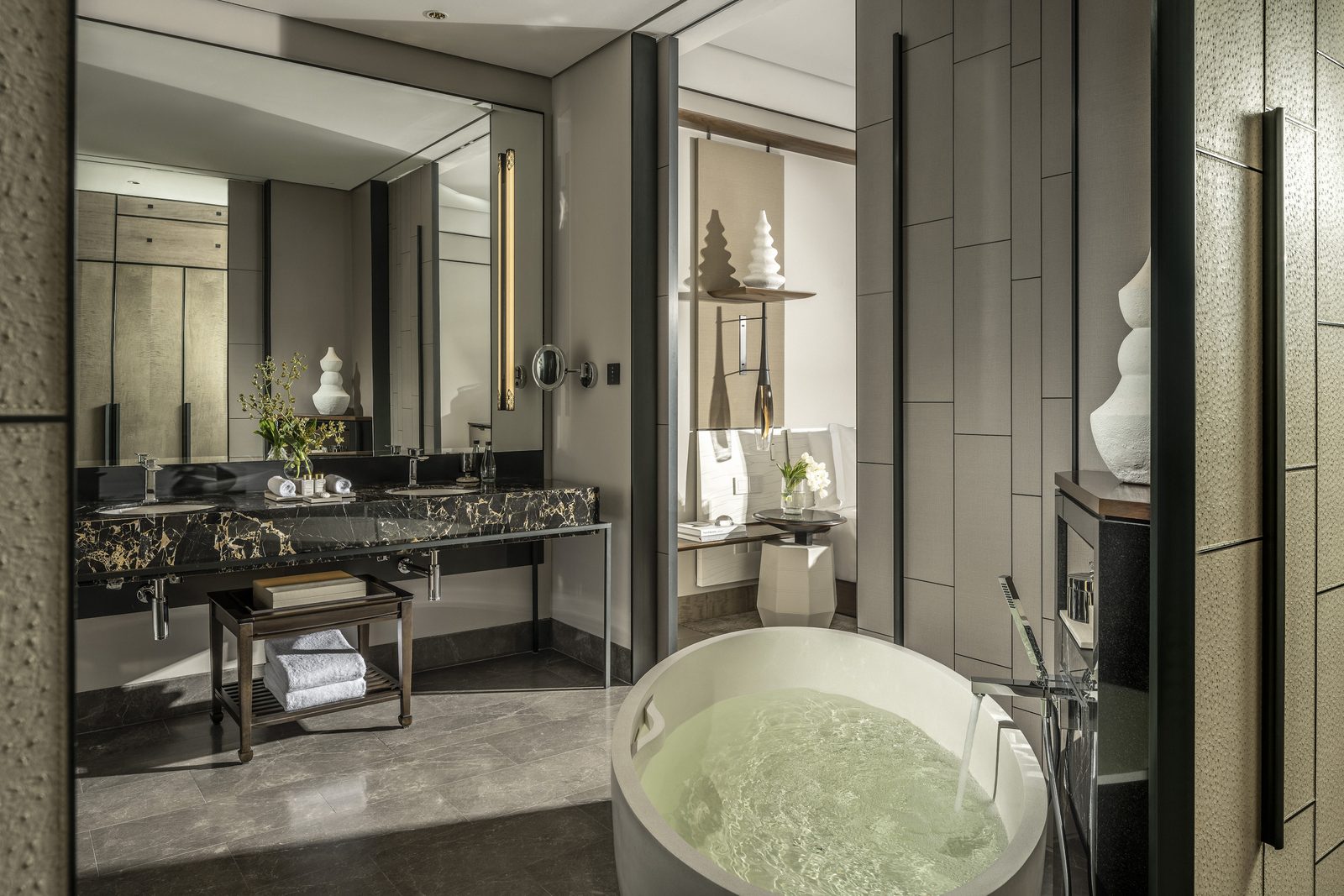 Bathroom with a freestanding soaking tub at Four Seasons Hotel Bangkok