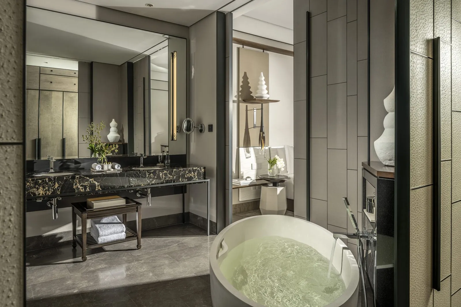 Bathroom with a freestanding soaking tub at Four Seasons Hotel Bangkok