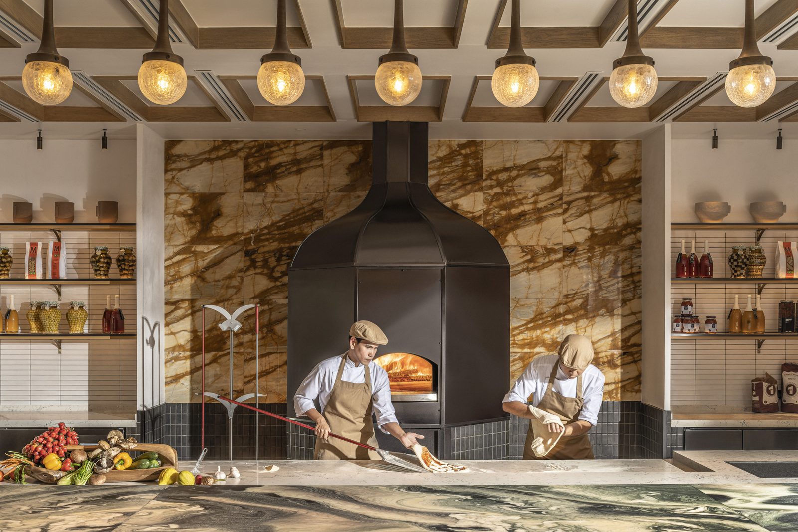 Chefs at the wood-fired pizza oven of Riva del Fiume, Four Seasons Hotel Bangkok
