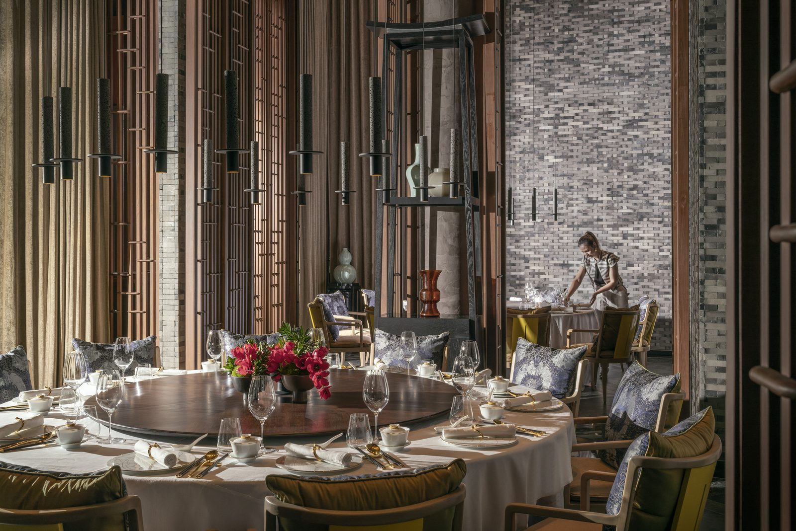 Round table set for dinner at Yu Ting Yuan, the Cantonese restaurant at Four Seasons Hotel Bangkok