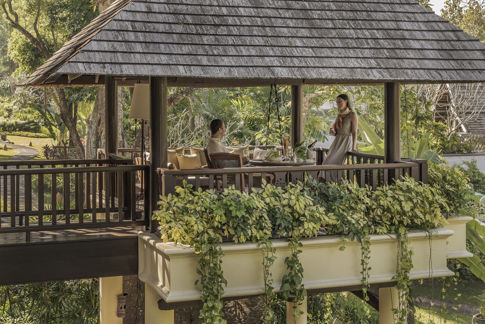 Open-air pavilion dining in the gardens of Four Seasons Resort Chiang Mai