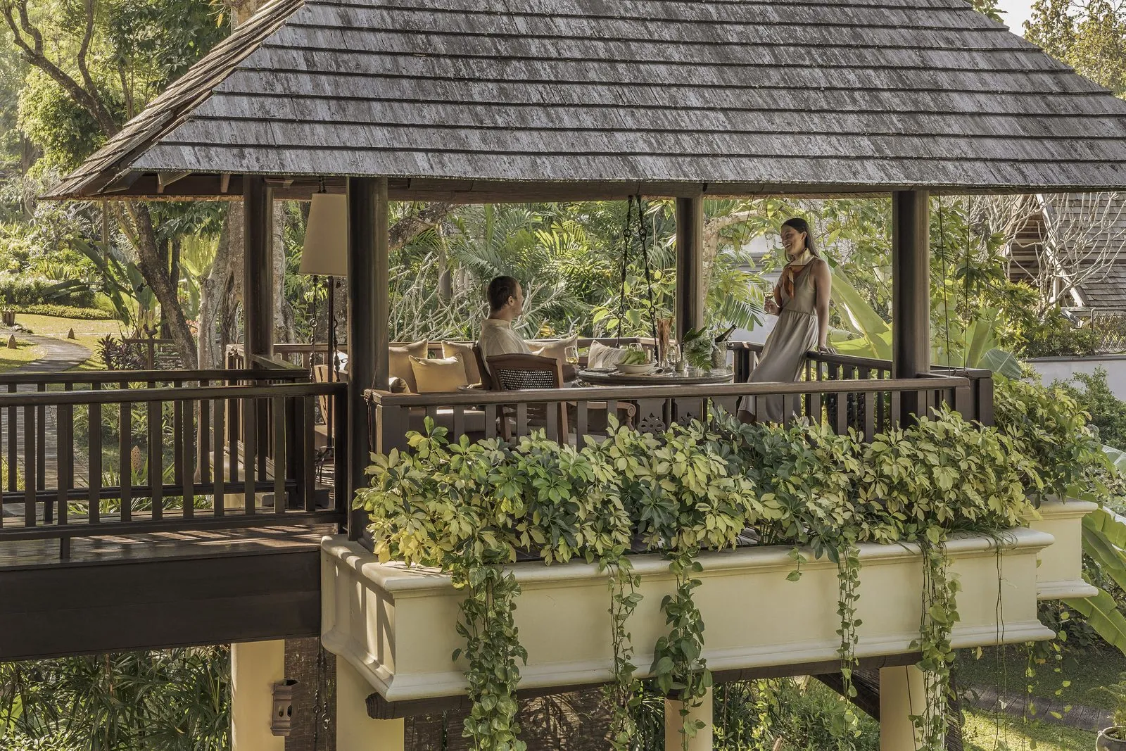 Open-air pavilion dining in the gardens of Four Seasons Resort Chiang Mai
