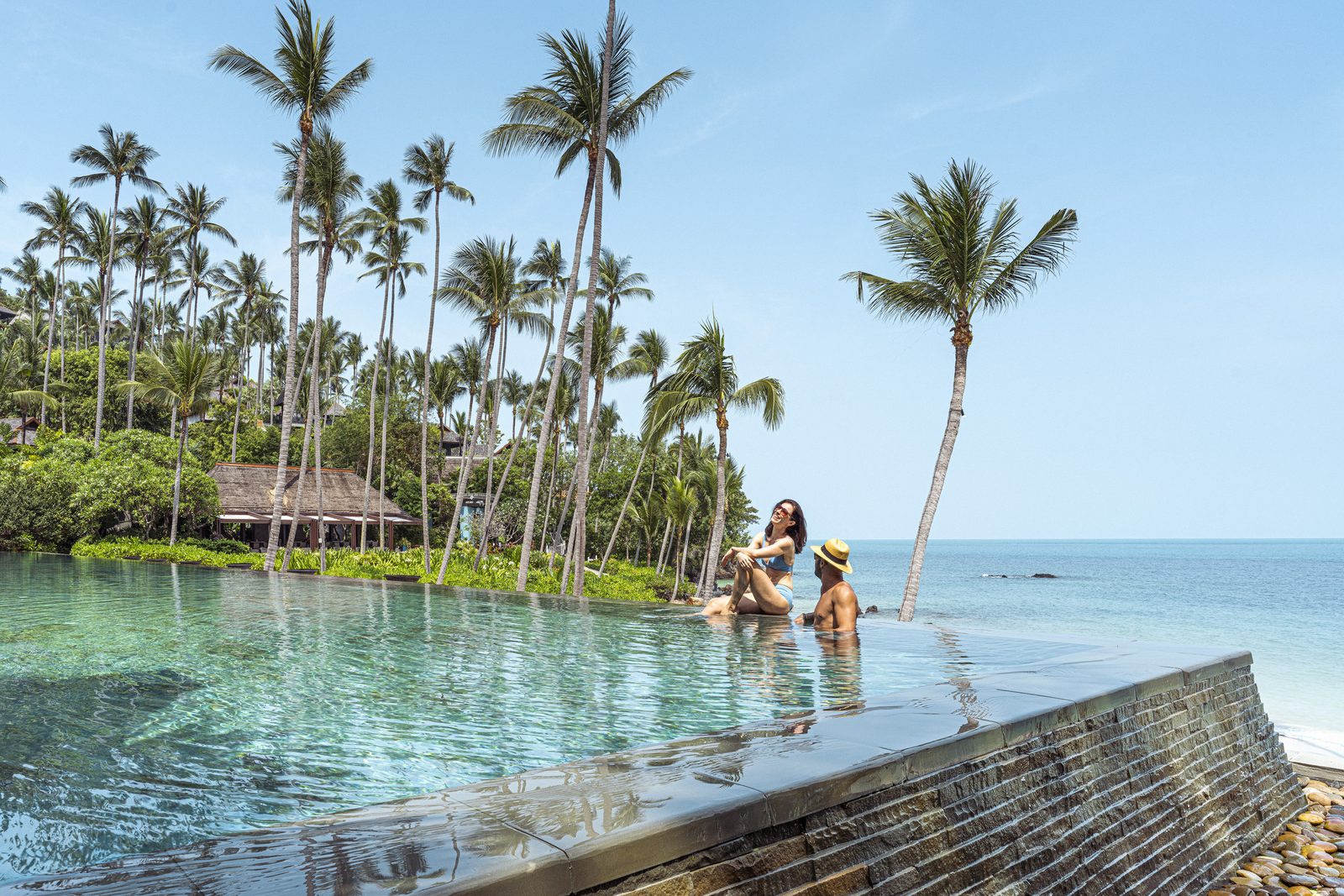 Main infinity pool beside the beach at Four Seasons Resort Koh Samui