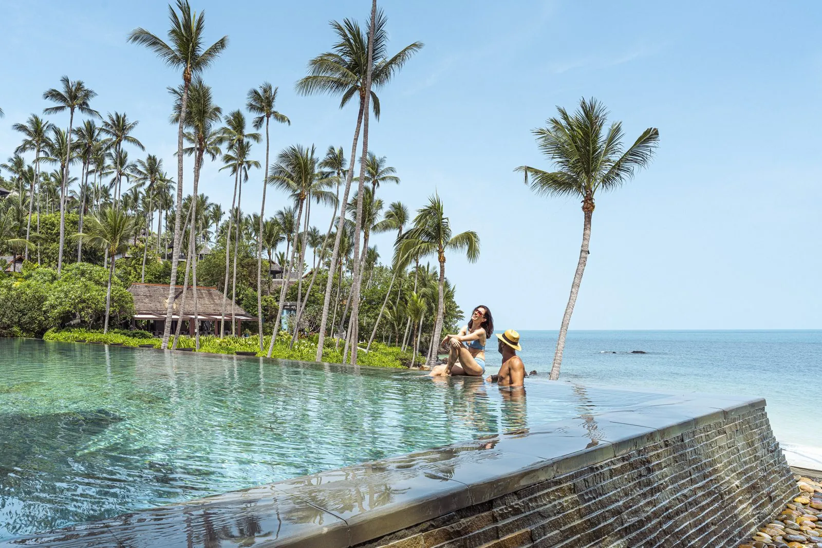 Main infinity pool beside the beach at Four Seasons Resort Koh Samui
