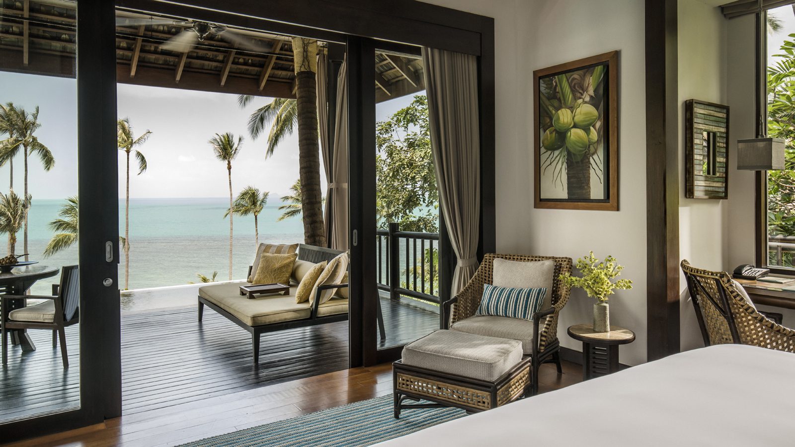 Villa interior opening onto a sea-view balcony at Four Seasons Resort Koh Samui