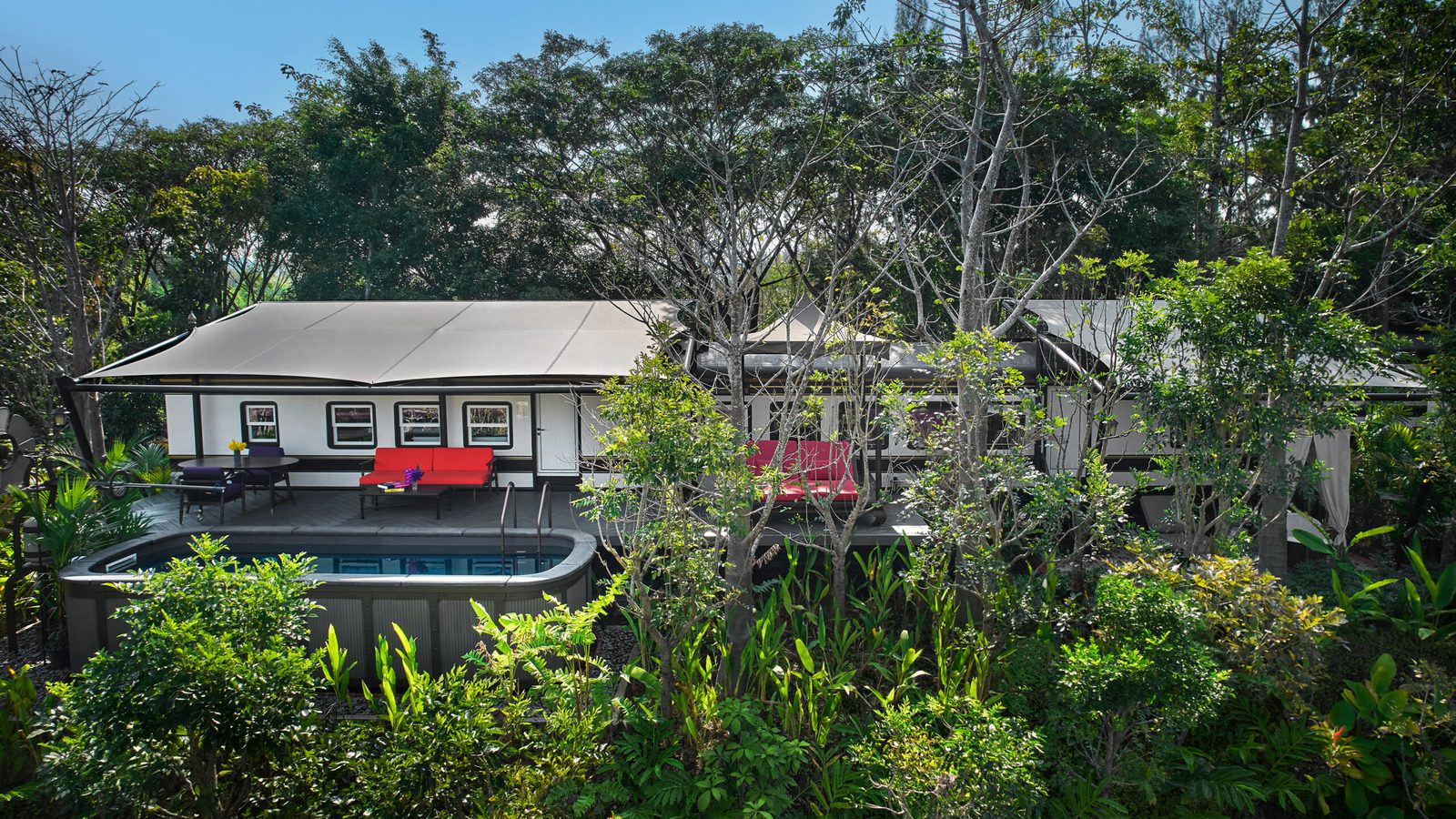 Aerial view of a Heritage Railcar 1 Bedroom Pool Villa and its plunge pool at InterContinental Khao Yai Resort