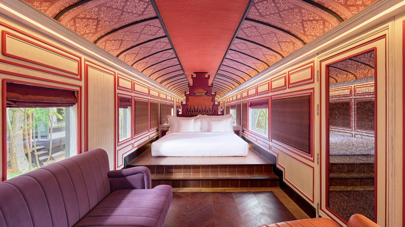 Bedroom inside a restored railcar in a Heritage Railcar Pool Villa, InterContinental Khao Yai Resort