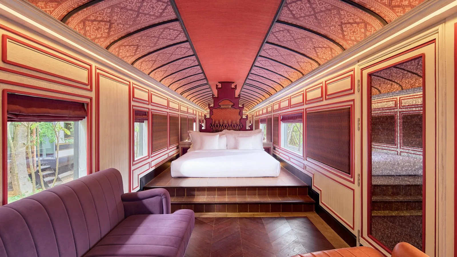 Bedroom inside a restored railcar in a Heritage Railcar Pool Villa, InterContinental Khao Yai Resort