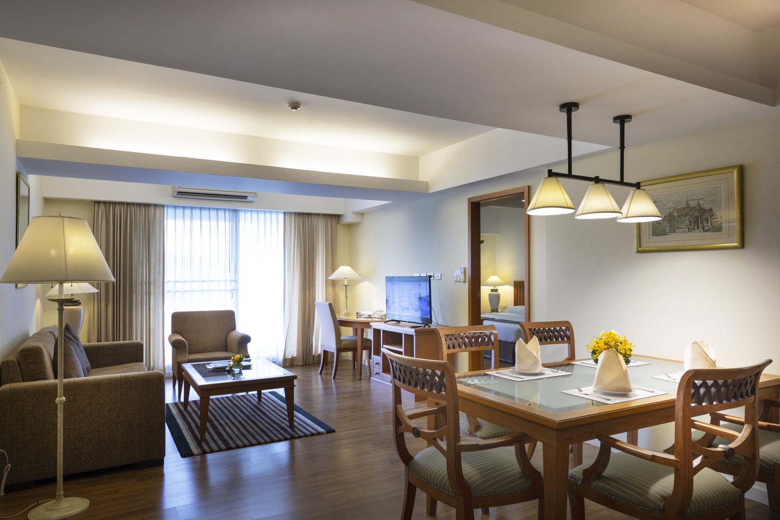 Two Bedroom Suite living and dining room at Kameo Grand Hotel, Rayong