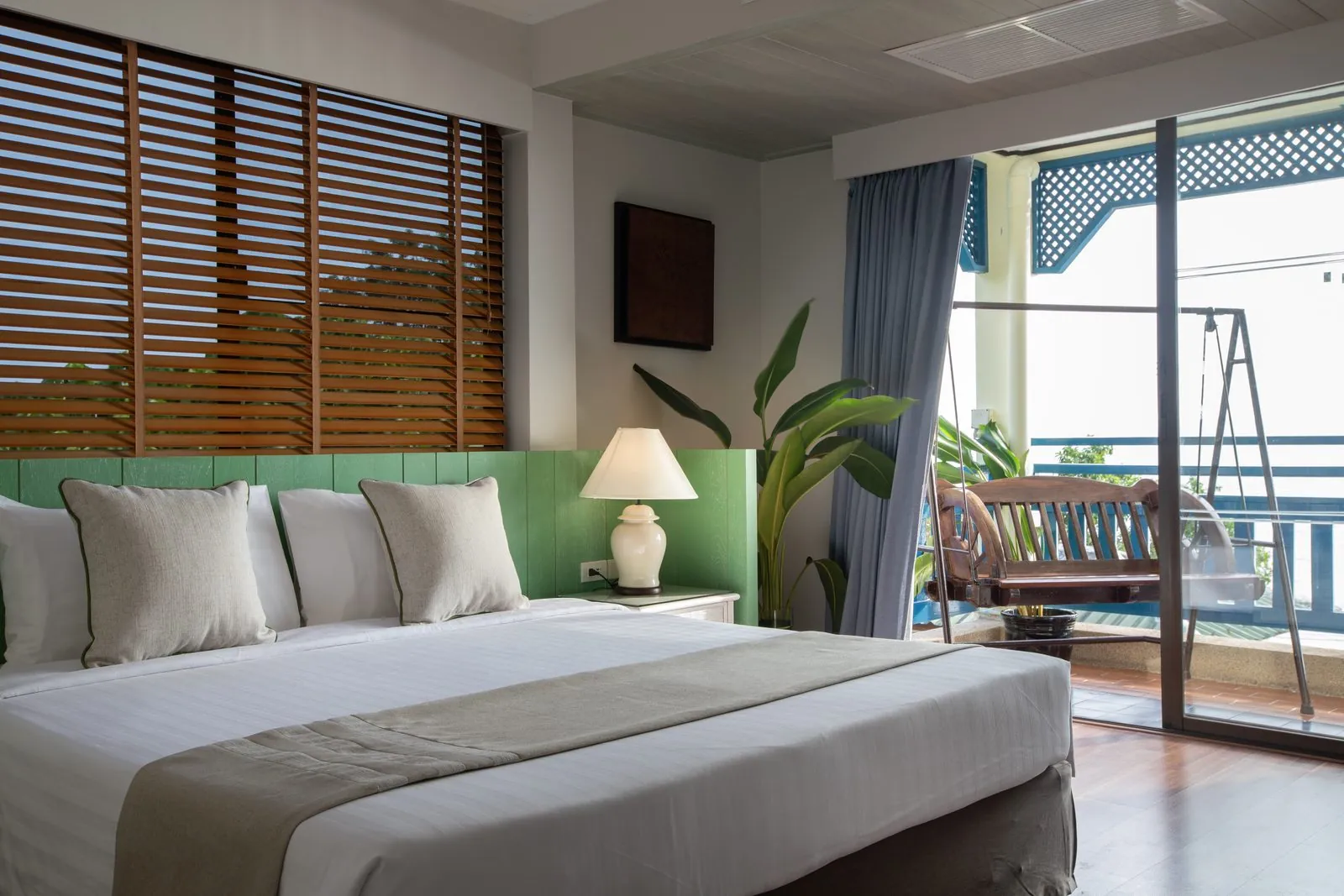 Bedroom with balcony in a two-bedroom unit at Kantary Bay Hotel, Phuket