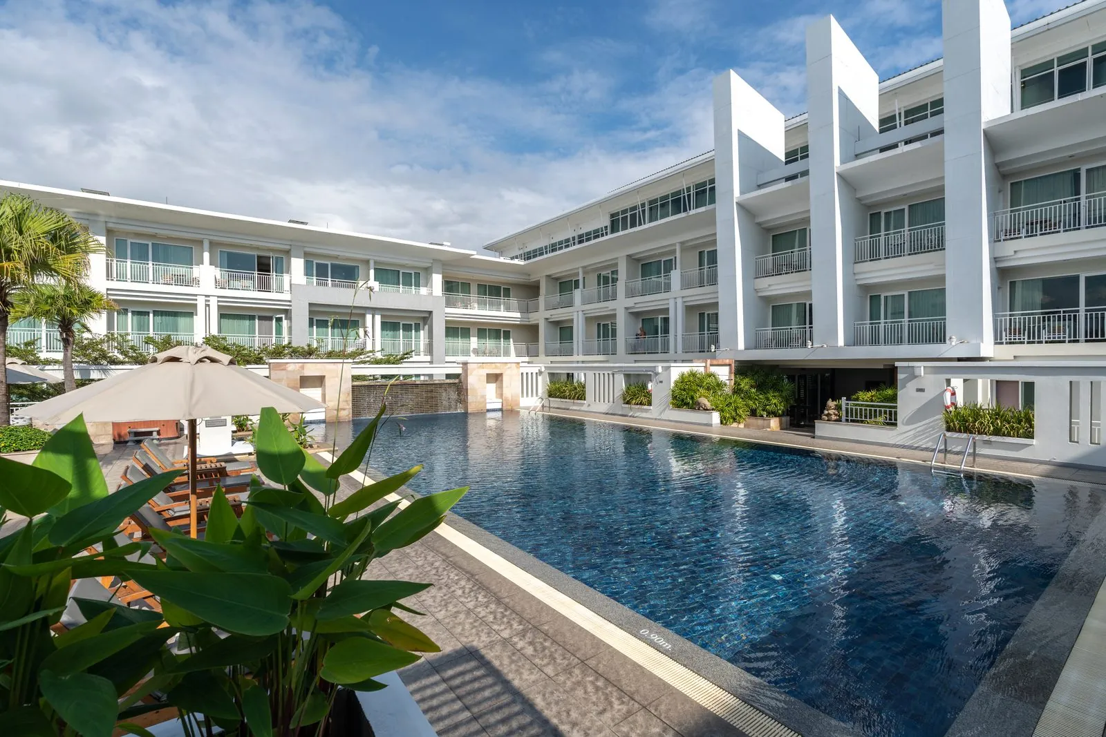 Outdoor swimming pool framed by the guest wings of Kantary Hills Hotel, Chiang Mai