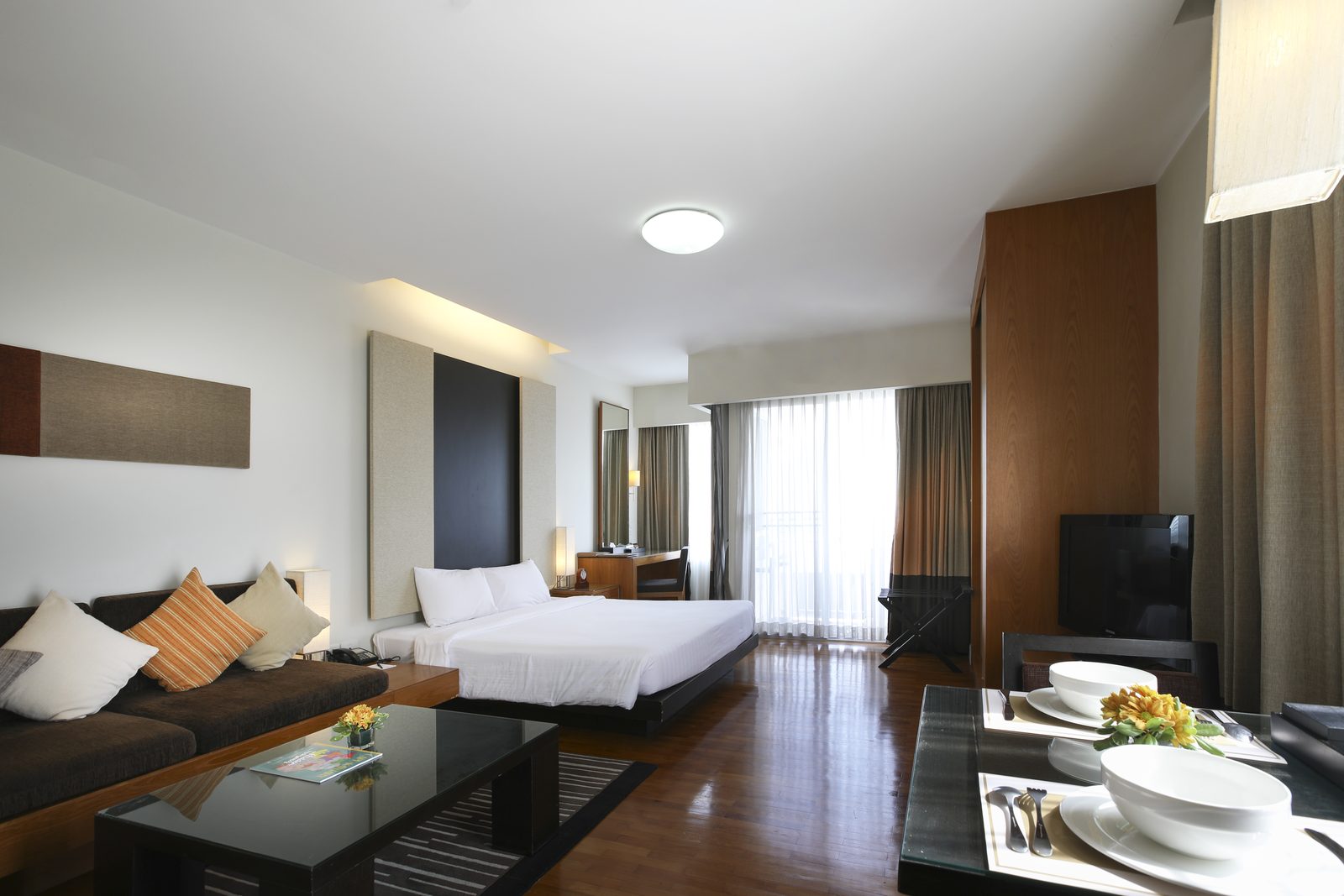 Studio with bed, sofa and dining table at Kantary Hotel, Ayutthaya