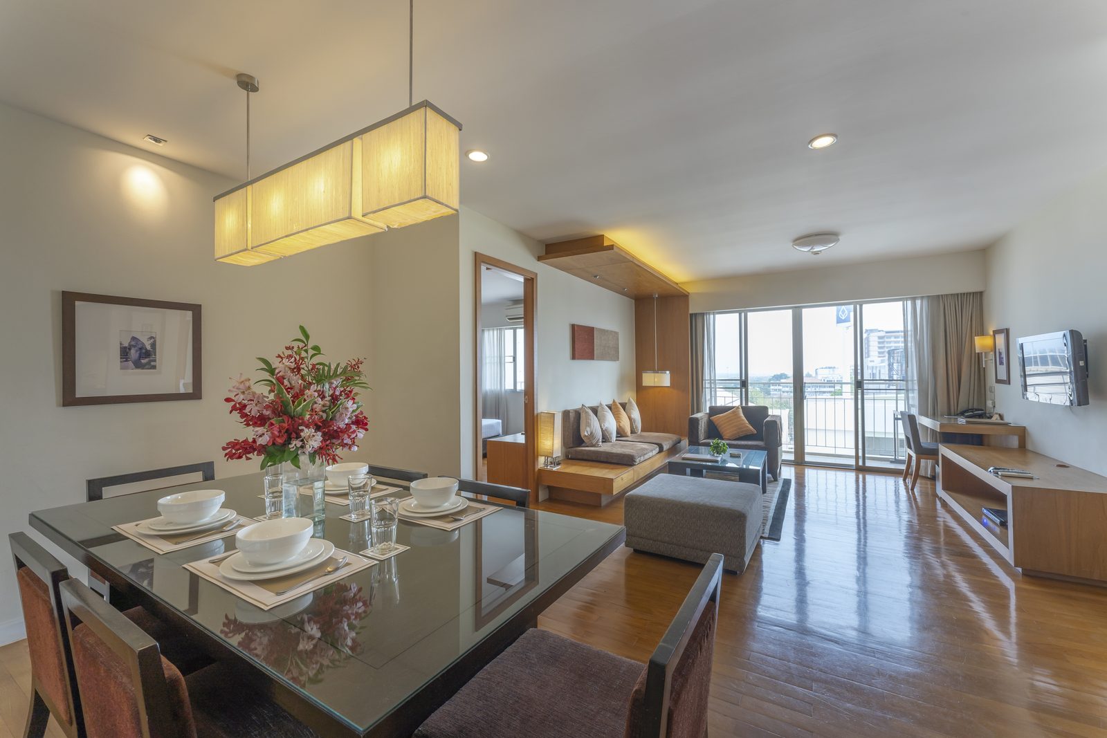Two Bedroom Suite living and dining room with balcony at Kantary Hotel, Ayutthaya