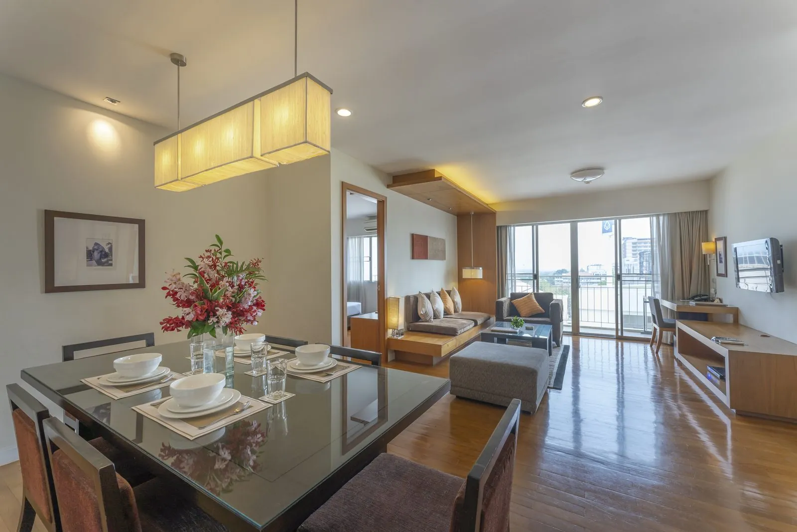Two Bedroom Suite living and dining room with balcony at Kantary Hotel, Ayutthaya
