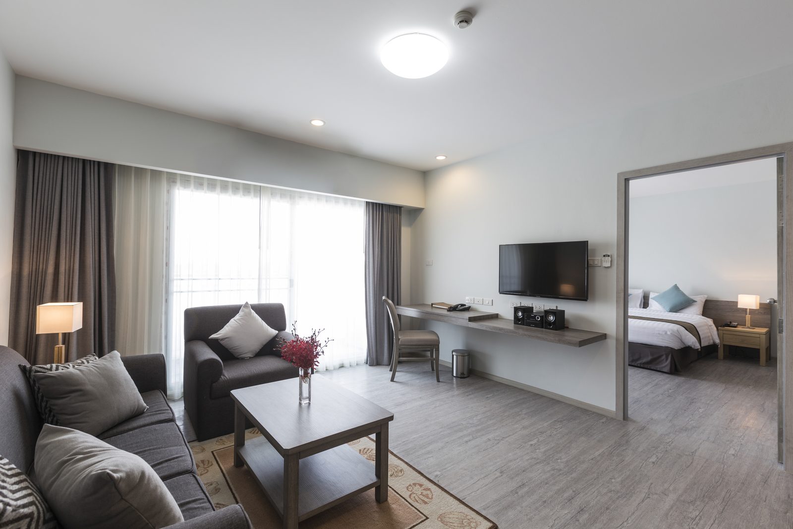 One Bedroom Suite living room with bedroom beyond at Kantary Hotel, Bangpakong