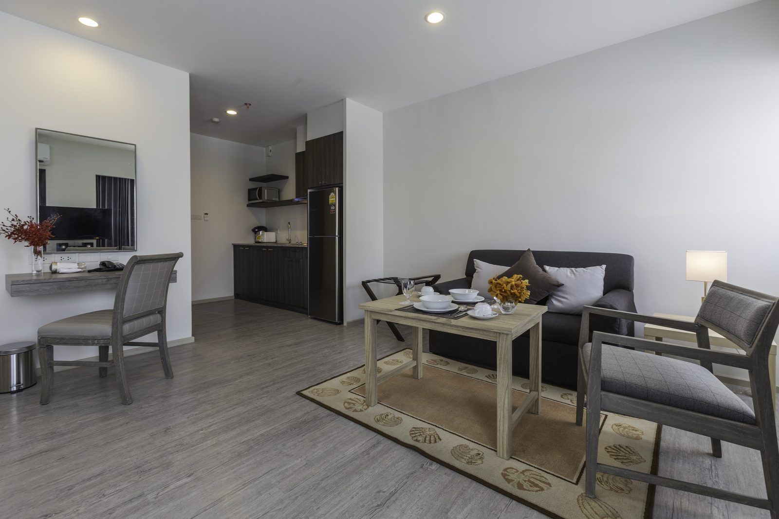 Studio Suite living and dining area with kitchenette at Kantary Hotel, Bangpakong
