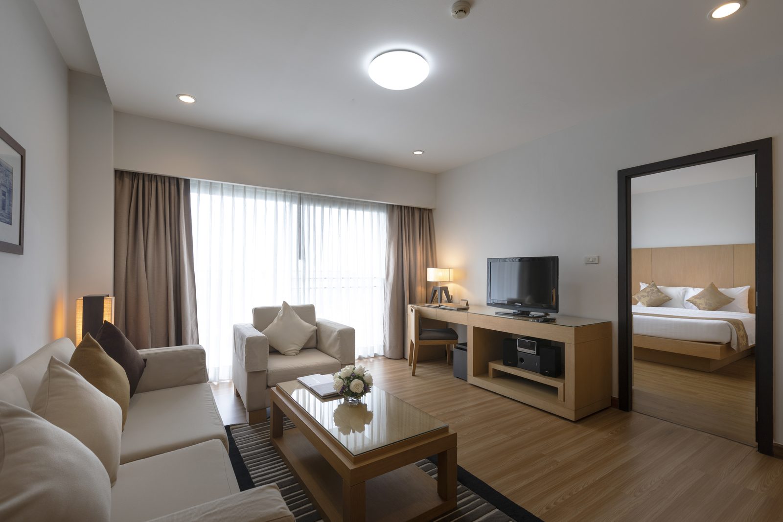 One Bedroom Suite living room with bedroom beyond at Kantary Hotel, Kabinburi