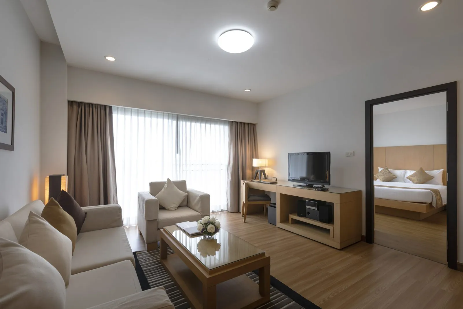 One Bedroom Suite living room with bedroom beyond at Kantary Hotel, Kabinburi