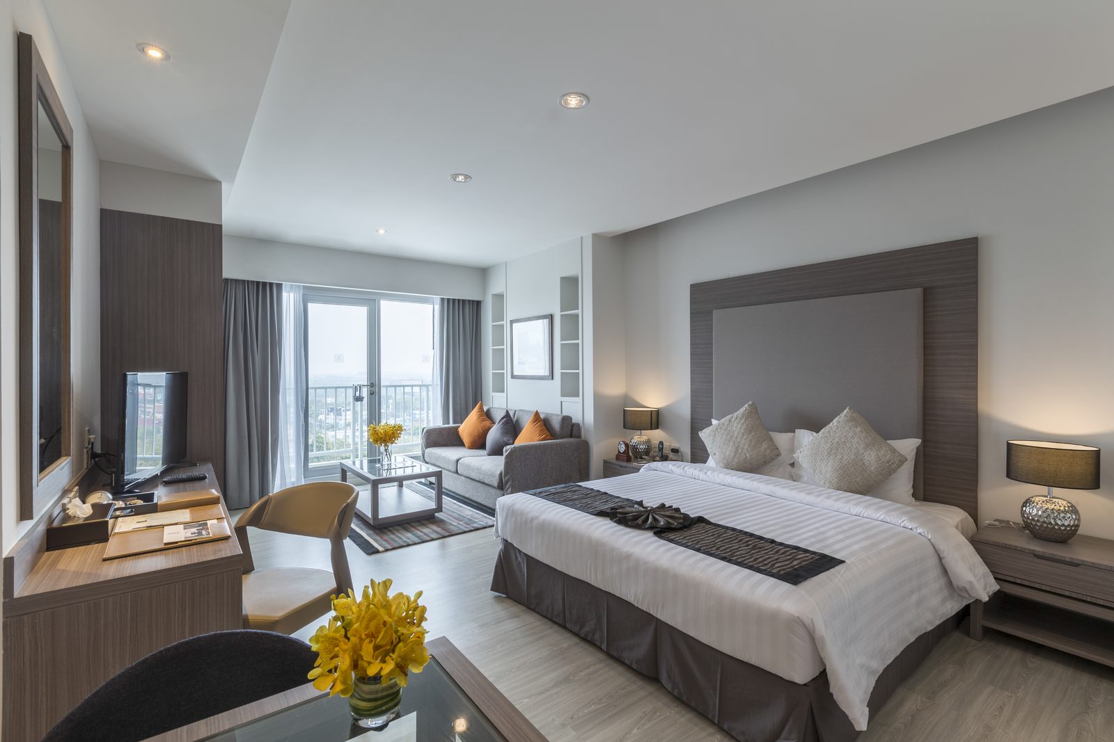 Studio Suite bedroom and sitting area at Kantary Hotel, Korat