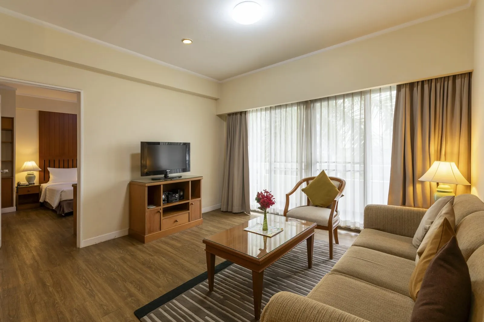 One Bedroom Suite living room with view into the bedroom at Kantary House Hotel, Bangkok