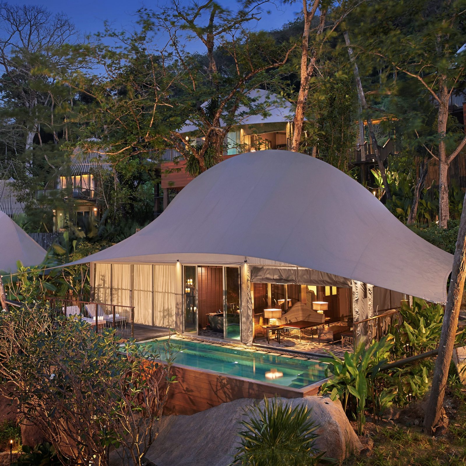 Canvas roof and private pool of a Tent Pool Villa at Keemala at dusk