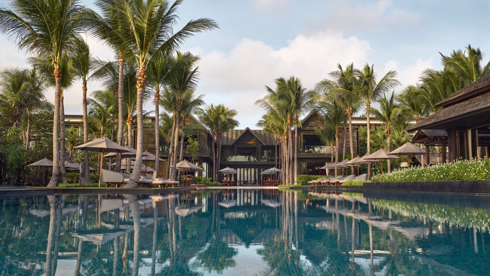Palm-lined main pool at Kimpton Kitalay Samui on Choeng Mon Beach