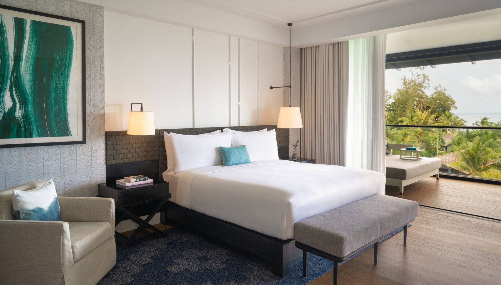 One Bedroom Suite bedroom with king bed at Kimpton Kitalay Samui