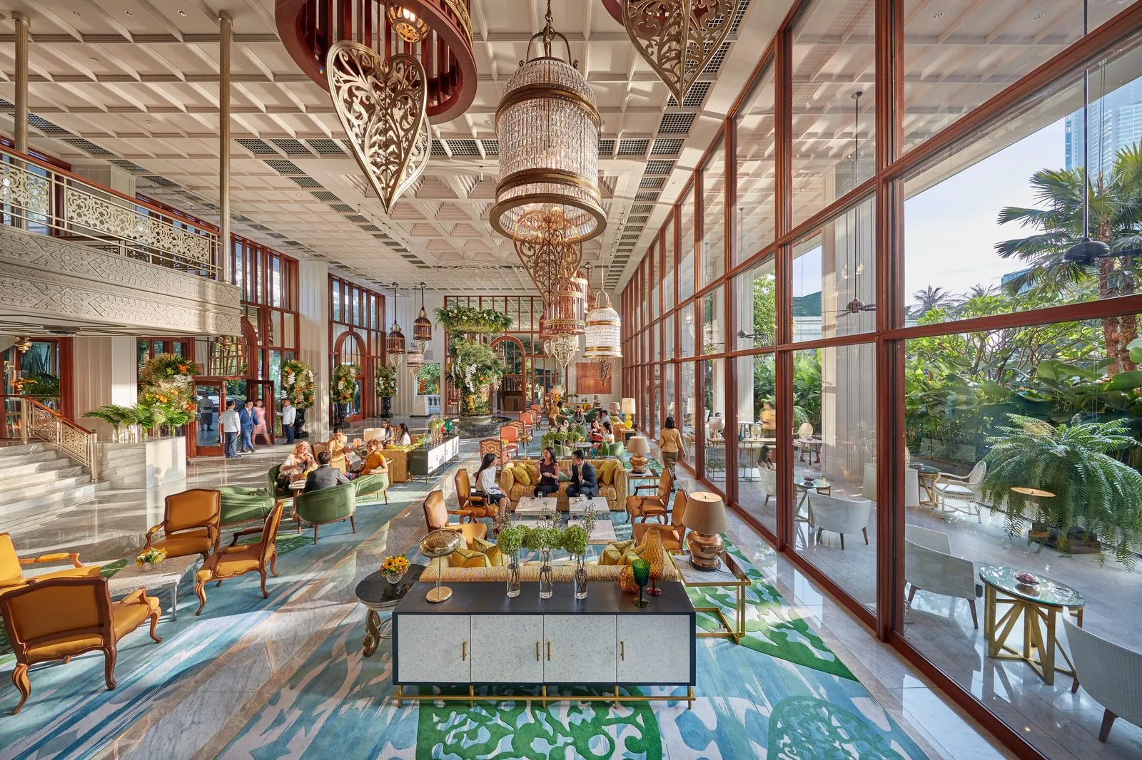 High-ceilinged lobby with chandeliers and garden windows at Mandarin Oriental, Bangkok