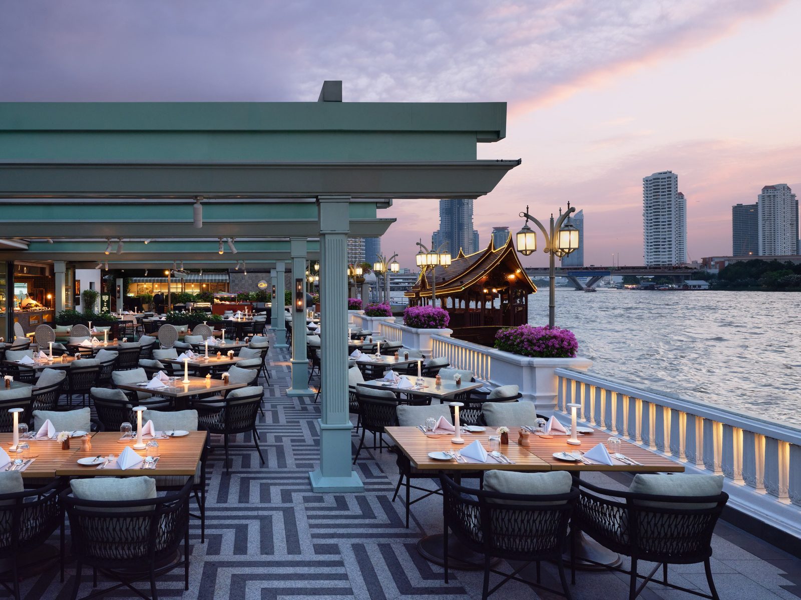 Riverside Terrace restaurant at dusk beside the Chao Phraya at Mandarin Oriental, Bangkok