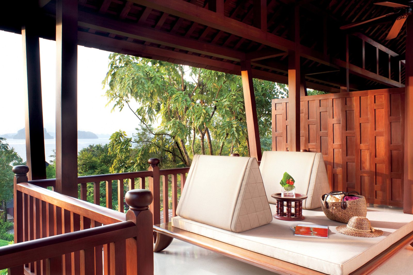Ocean Pavilion balcony with lounge bed and sea view at Phulay Bay, a Ritz-Carlton Reserve