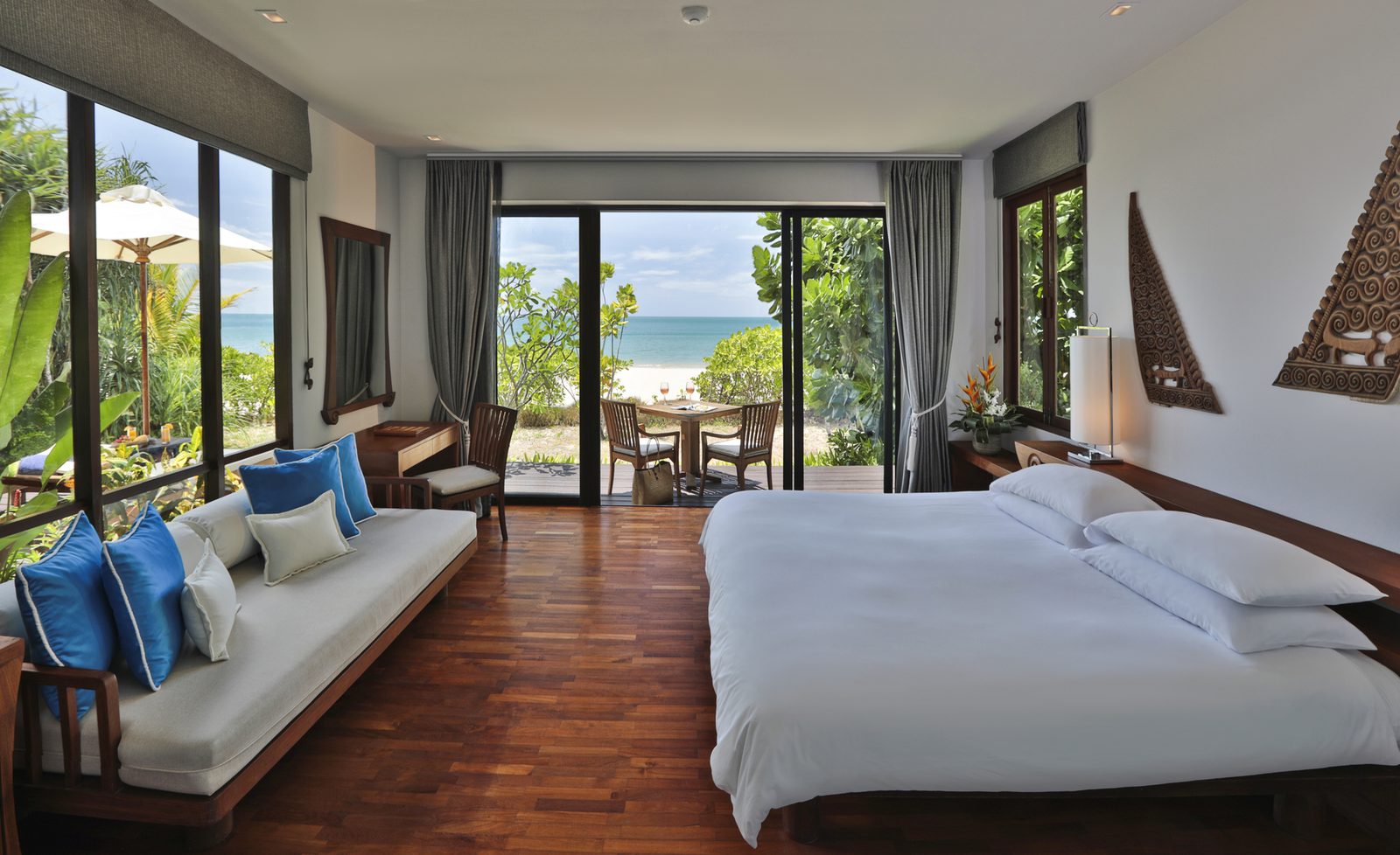 Bedroom and sitting area of a One Bedroom Beachside Pavilion Suite at Pimalai, Koh Lanta