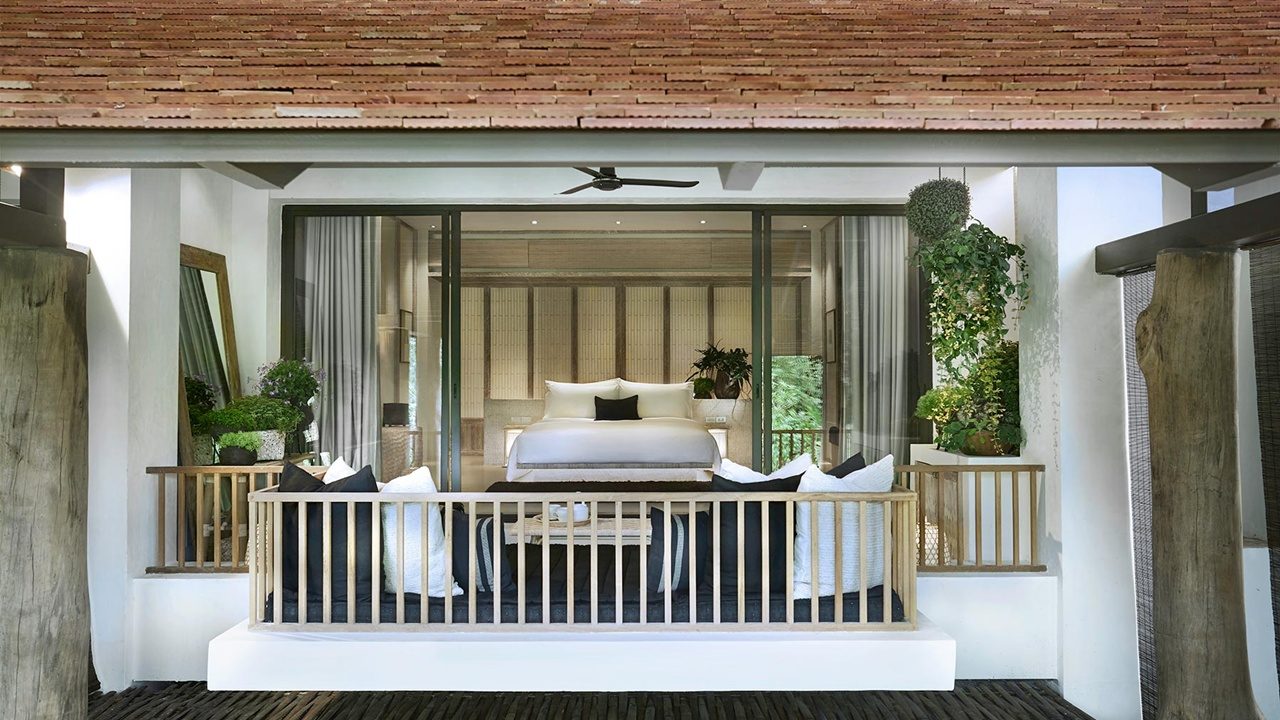 Rin Terrace Suite bedroom seen from its covered terrace at Raya Heritage