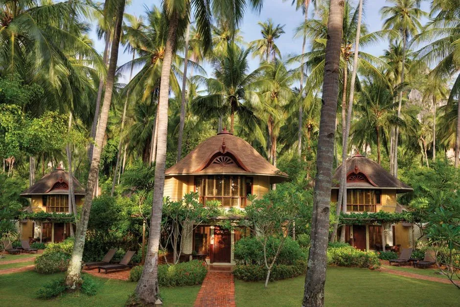 Two-storey Deluxe Pavilions among palms at Rayavadee, Krabi