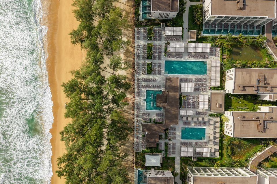 Aerial view of Hotel Riu Palace Phuket with its pools and gardens beside Mai Khao Beach