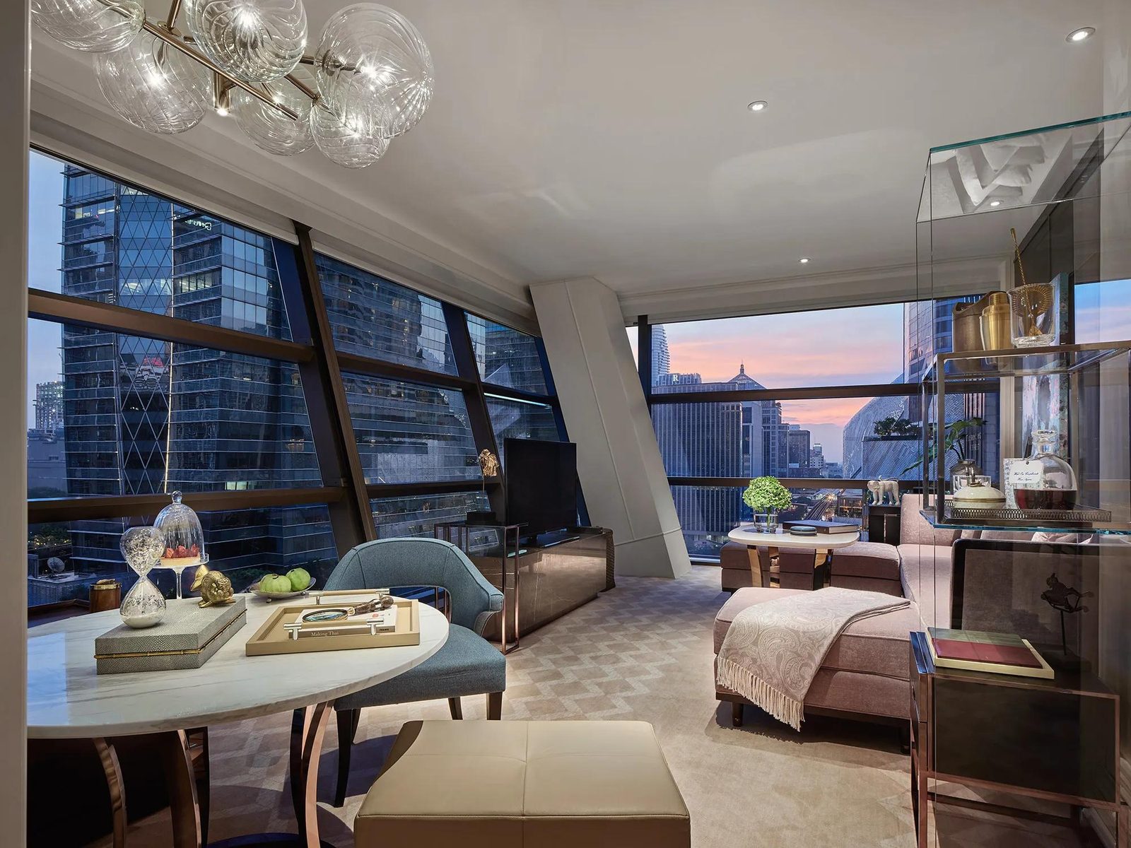 Living room of a Manor Suite at Rosewood Bangkok with skyline views
