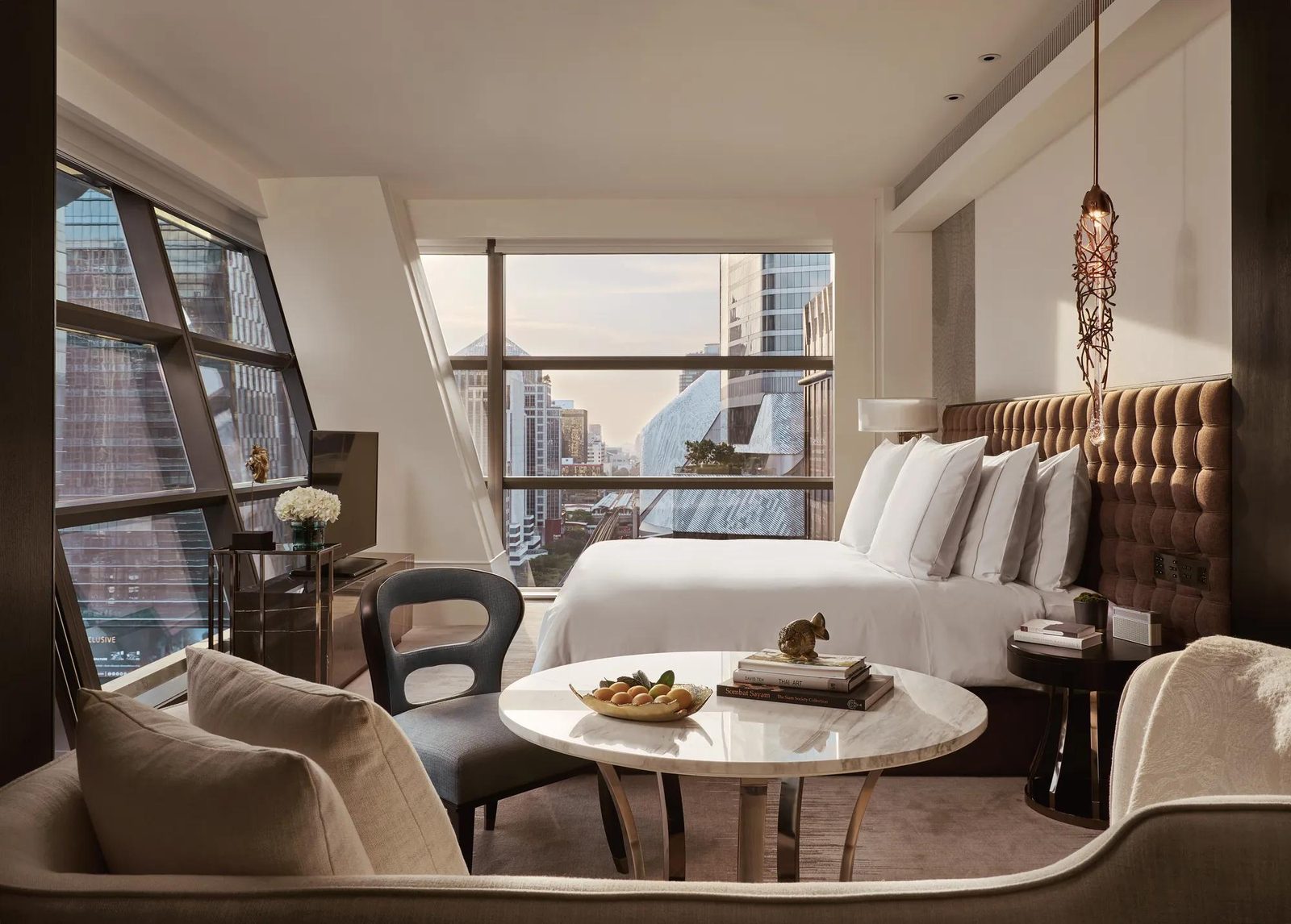 Premier Room at Rosewood Bangkok, a corner room with floor-to-ceiling windows over the city