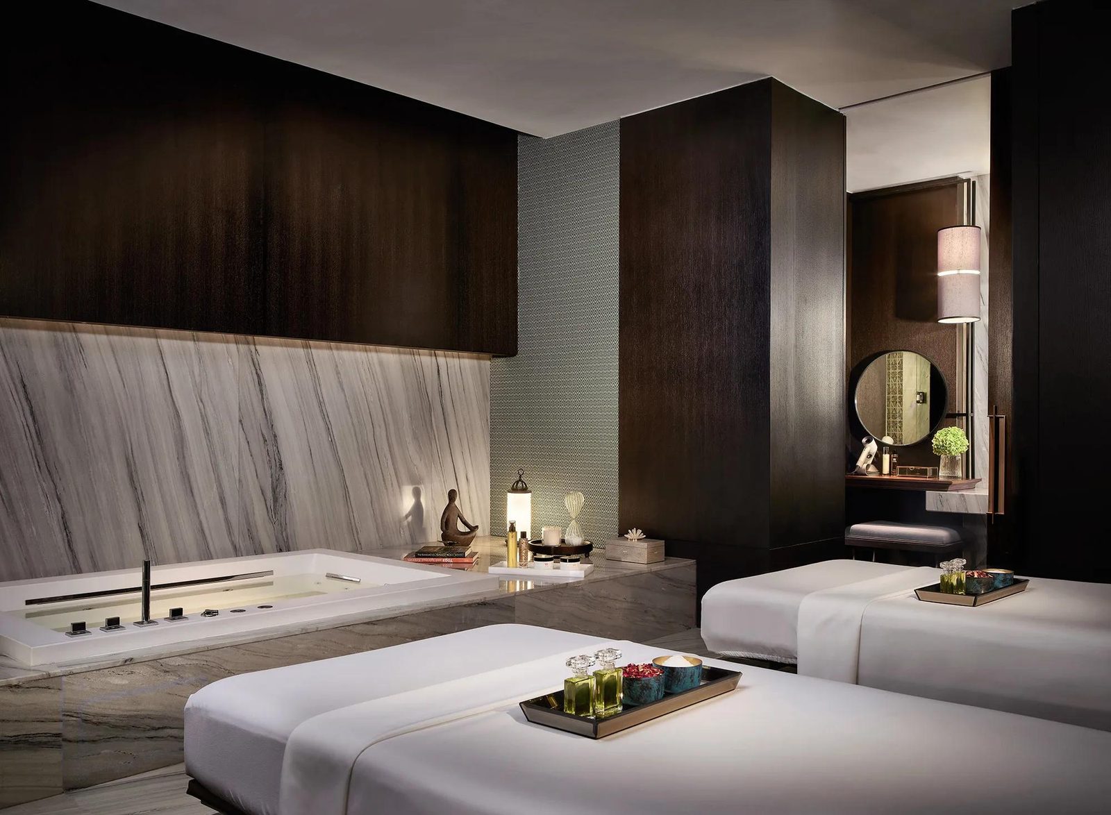 Treatment room with two beds at Sense, A Rosewood Spa, Rosewood Bangkok