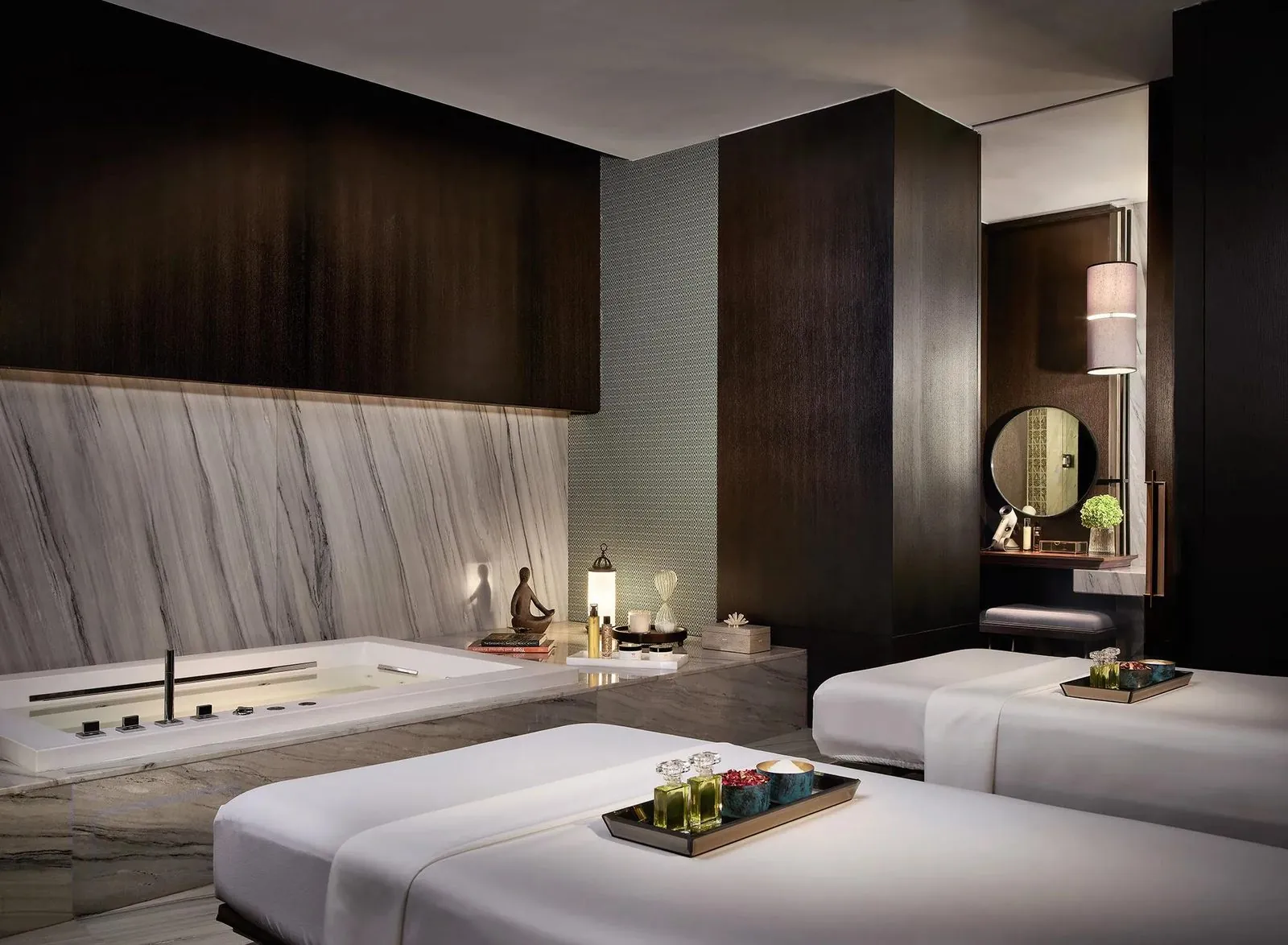 Treatment room with two beds at Sense, A Rosewood Spa, Rosewood Bangkok