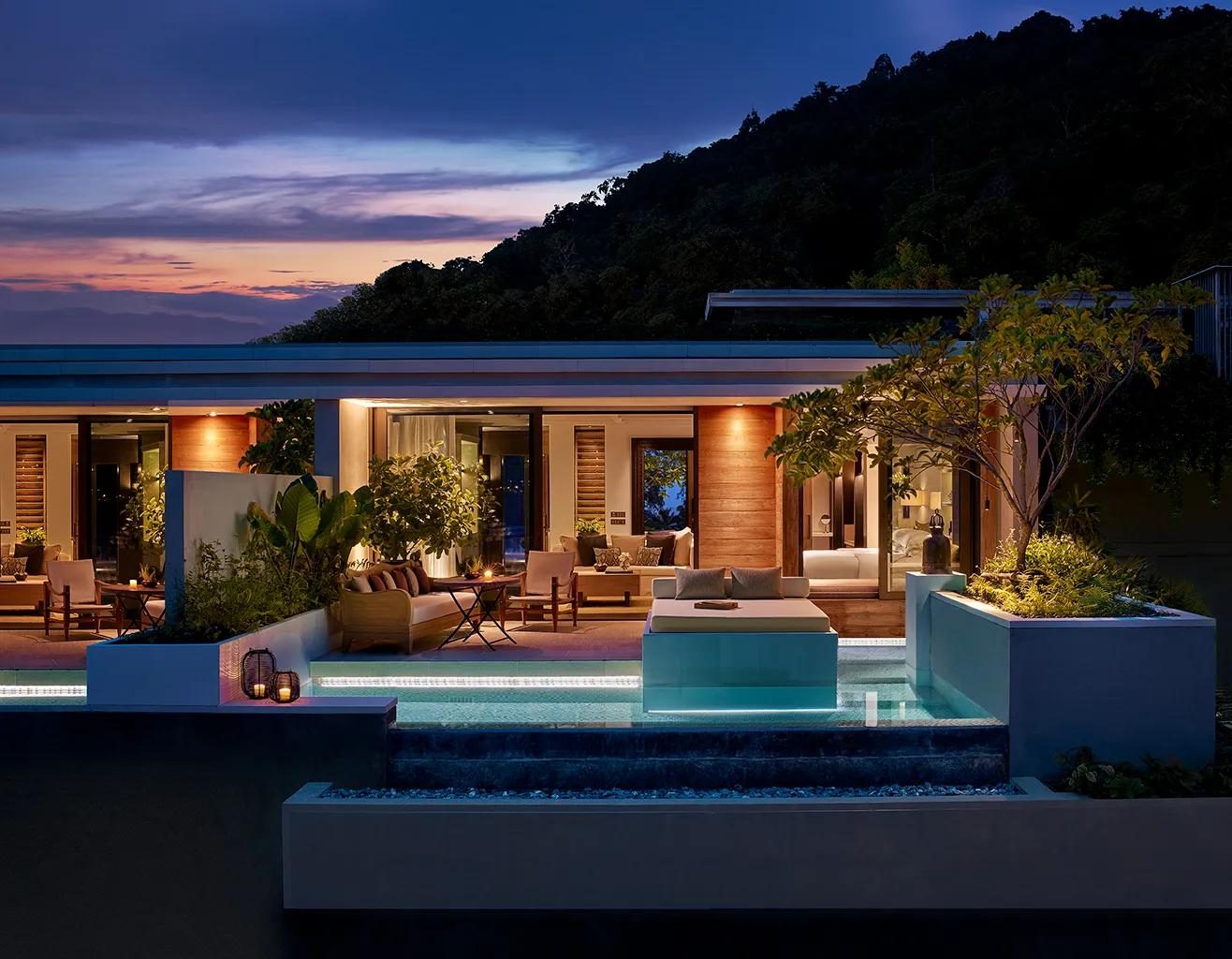 Terrace and plunge pool of a Partial Ocean View Pool Pavilion at Rosewood Phuket at dusk