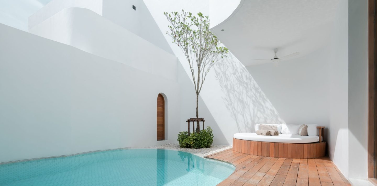 Walled courtyard with private pool, deck and round daybed in a Garden Pool Villa at SALA Samui Chaweng Beach Resort