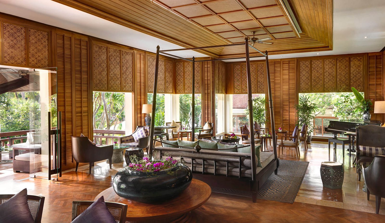 Lobby lounge with Thai timber screens and a grand piano at Santiburi Koh Samui