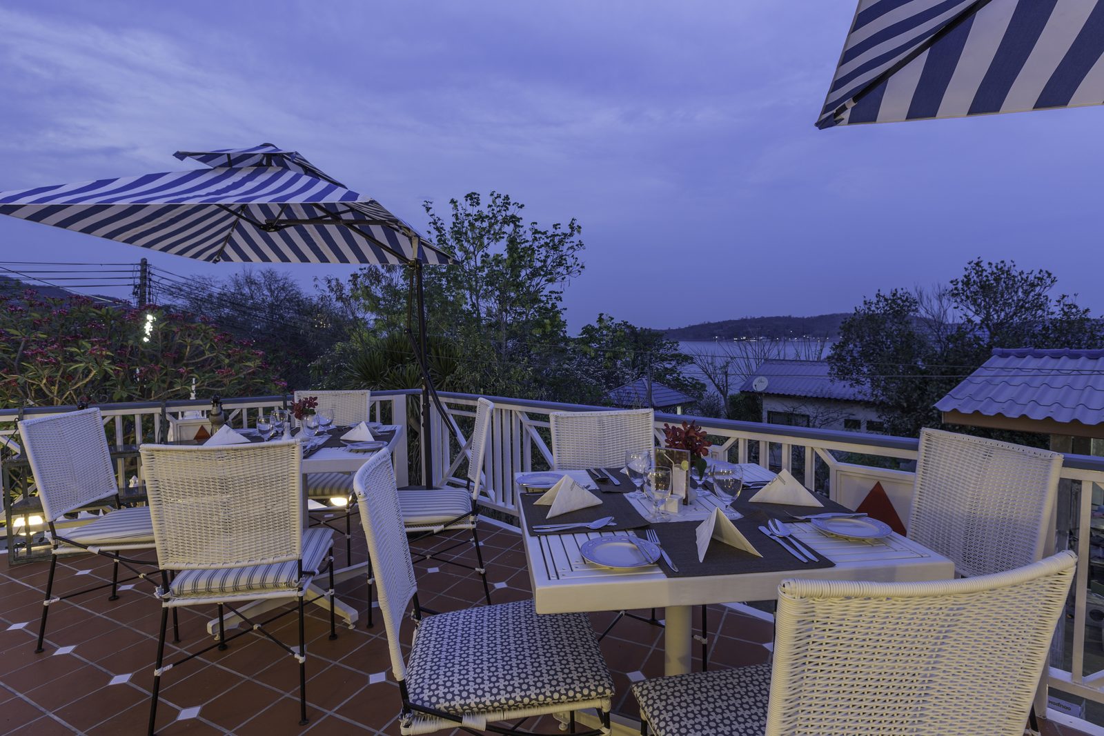 Outdoor terrace of The Verandah at dusk, Somewhere Hotel, Koh Sichang